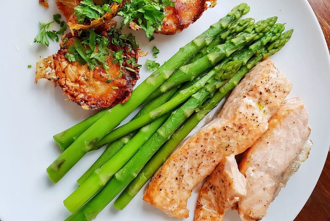 Baked fish with asparagus in a low-carb diet menu