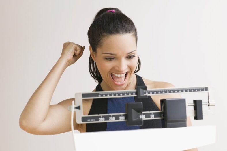 A woman who is happy with her weight loss magic diet